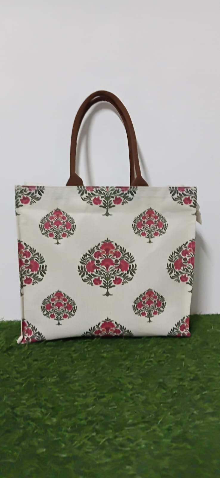 Red floral hand bag with brown handles